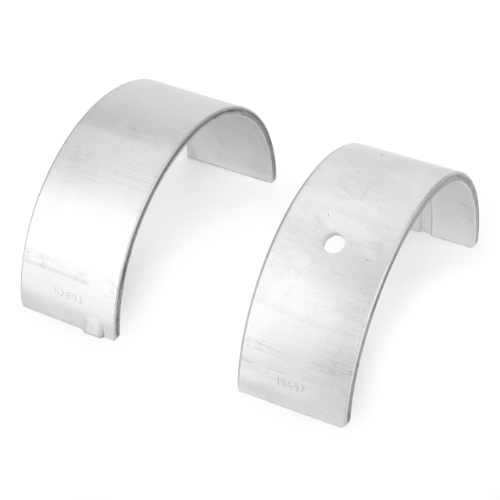 Two silver metallic curved bearing shells, one with a hole and the other without, placed side by side on a white background, showcasing AGCO's Massey Ferguson main bearing model V836655514 compatible with various Massey Ferguson models.