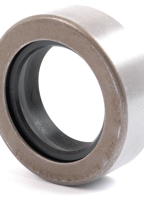 Close-up of a metal roller bearing with an inner black rubber seal. The cylindrical bearing, equipped with the Metric Rotary Shaft Seal (37.5 x 60 x 20mm) from Sparex (Part No.S.65671), has visible engraved text around its edges. Ideal for Ford / New Holland machinery, it is available through Sparex for reliable performance and fit.