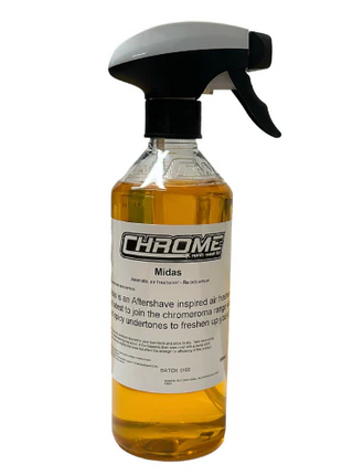 A 500ML spray bottle labeled "Chrome - Midas" from JMCE, containing an aftershave-inspired air freshener infused with citrus and honey undertones, designed to refresh rooms and act as a Re Odouriser.