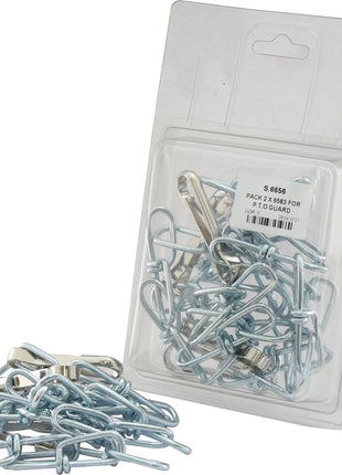 A clear plastic package from Sparex labeled "PACK 2 X 6583 FOR P.T.O GUARD | Sparex Part No.S.6656" containing several metal clips, with additional clips scattered in front. The package features a white label with text and a barcode, suitable for P.T.O guard or other agricultural uses.