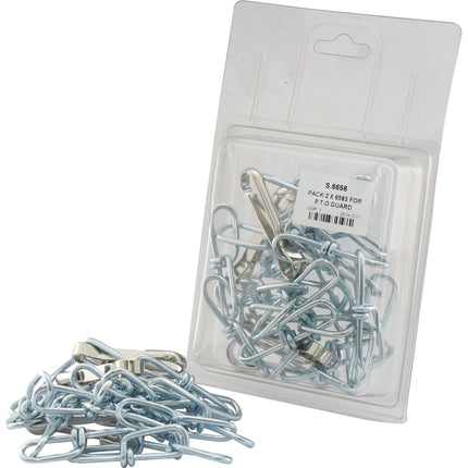 A clear plastic package from Sparex labeled "PACK 2 X 6583 FOR P.T.O GUARD | Sparex Part No.S.6656" containing several metal clips, with additional clips scattered in front. The package features a white label with text and a barcode, suitable for P.T.O guard or other agricultural uses.