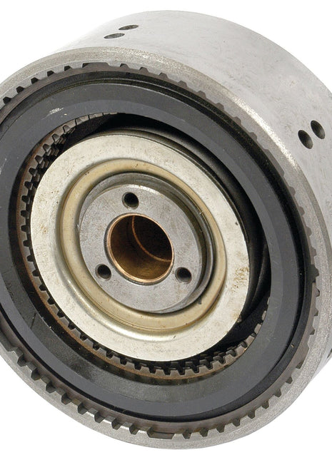 A close-up of a metal mechanical component with multiple interlocking gears and a central cylindrical bearing, resembling the precision found in the Sparex PTO Clutch Pack (Part No. S.66262).