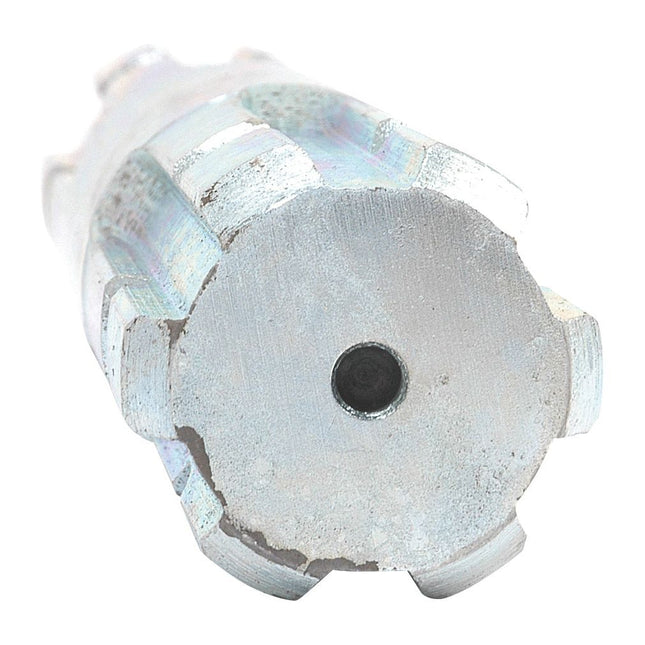 Close-up of a Sparex metal drill bit end with a cylindrical shape and multiple grooves, resembling the intricate design of the Sparex PTO Splined Shaft - Both Ends - 1 3/8'' - 6 Spline x 1 3/8'' - 6 Spline, Length: 230mm (Part No. S.16428).