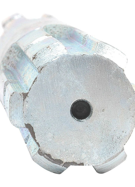 Close-up of a cylindrical metal object with a central hole, featuring six evenly spaced notches around its edge, resembling the PTO Splined Shaft - Both Ends - 1 3/8'' - 6 Spline x 1 3/8'' - 6 Spline, Length: 300mm from Sparex (Part No. S.15952).