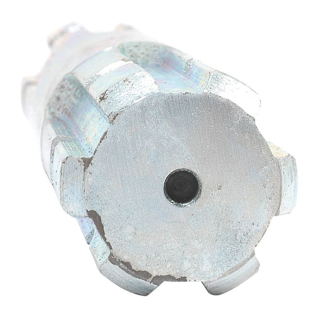 Close-up of a cylindrical metal object with a central hole, featuring six evenly spaced notches around its edge, resembling the PTO Splined Shaft - Both Ends - 1 3/8'' - 6 Spline x 1 3/8'' - 6 Spline, Length: 300mm from Sparex (Part No. S.15952).