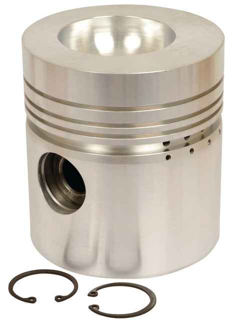 The Sparex Piston (Standard) - S.42929 features precision engineering with grooves, holes, and a top indentation, and is displayed alongside two circular snap rings to showcase its optimal compression height.