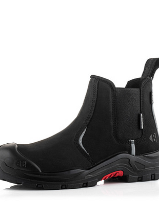 The Buckler Nubuckz Safety Dealer Boot, model Nkz101Bk, is a black ankle-high work boot that features a composite toe cap, thick non-slip sole, pull tabs on the front and back, and elastic side panels for ultimate safety footwear.