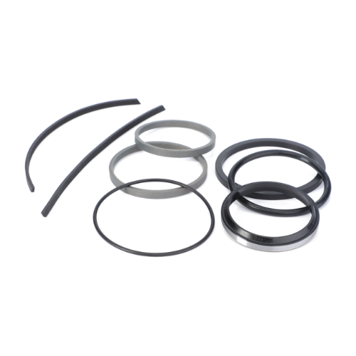 A collection of black rubber and gray metal rings of various sizes and shapes, reminiscent of the AGCO Massey Ferguson 3000 Series tractor Seal Kit Slave Cylinder (Product Code: 3600207M94), arranged on a white background.