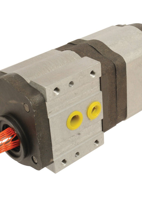 Close-up of the Tandem Hydraulic Pump - S.42172 by Sparex, featuring a metal casing, multiple ports, and a red wire connected at the end. This industrial-grade pump has a rectangular shape, making it ideal for heavy-duty applications.