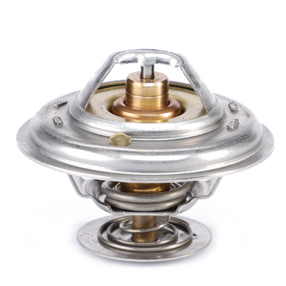 The AGCO Massey Ferguson Thermostat (model 4224639M1) is a metal automotive thermostat featuring a circular design and a visible spring mechanism, perfect for regulating the engine temperature in Massey Ferguson 4300 Series tractors.