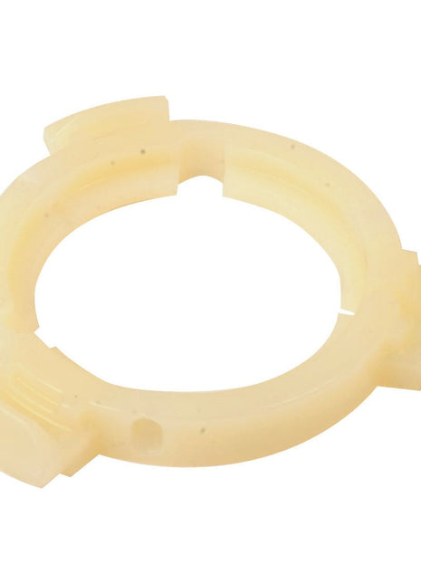 The PTO BEARING-EASYLOCK 50MM 3LUG - Weasler (Sparex Part No. S.59660) is a beige, circular plastic component featuring three evenly spaced lugs around its outer edge, specifically designed to fit a 50mm PTO bearing.