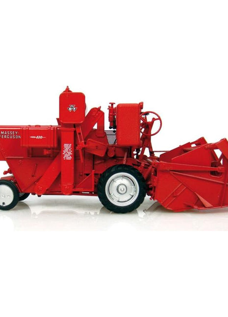 A vintage 1:32 scale Massey Ferguson - Mf 830 combine harvester by AGCO, displayed on a white background. The red model features visible wheels and harvesting components, with the brand name printed on the side.