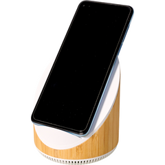 A smartphone rests on an AGCO Massey Ferguson Speaker and Phone Charger (X993342305000) tilt stand with a wood finish and built-in 15W fast wireless charger, displaying a blank black screen.