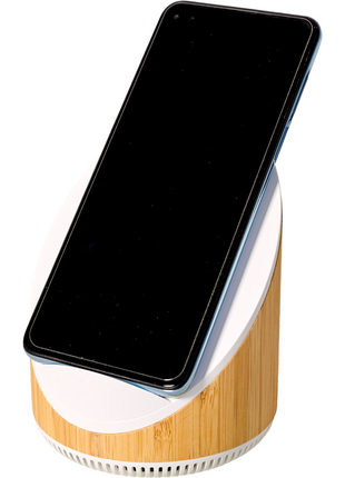 A smartphone rests on an AGCO Massey Ferguson Speaker and Phone Charger (X993342305000) tilt stand with a wood finish and built-in 15W fast wireless charger, displaying a blank black screen.