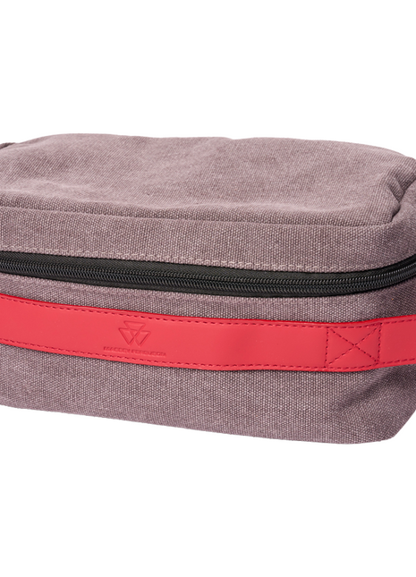 Introducing the AGCO Massey Ferguson Toiletry Bag (X993382301000): a rectangular canvas accessory in light greyish-purple, featuring a striking red handle, a sleek black zipper on top, and an elegant leather label.