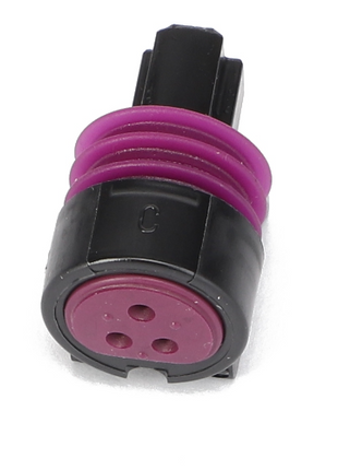 The AGCO | Socket Terminal - AG522498 from the brand AGCO is an electrical connector plug with a black casing and a purple seal, featuring three circular holes for connections.