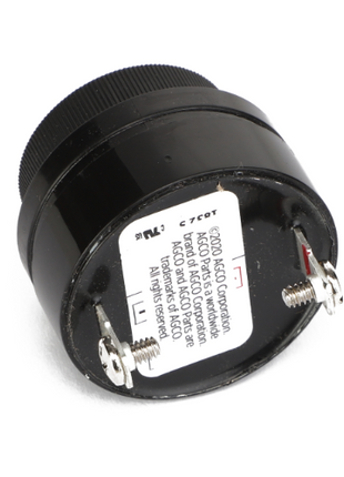 A round black electrical component labeled with technical specifications and featuring two protruding terminals on one end, identified as the AGCO Indicator - 8020638 by AGCO. No additional product description is available.