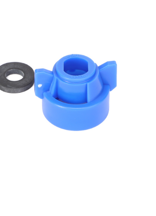 AGCO's Quick TeeJet Cap, Blue for Oval (ACP0484580) features a blue plastic component with two protrusions and a central cavity, accompanied by a small black washer on the left side, set against a white background. For product questions or if you need further assistance, please contact our support team.