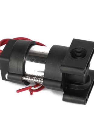 The AGCO SOLENOID VALVE - AG518117 is a small black and silver solenoid valve with red and black wires, featuring a mounting bracket and threaded port. No additional product description information is available beyond these details.