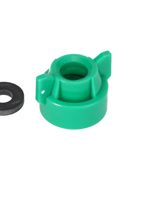 A green plastic AGCO Quick TeeJet Cap (Universal Fit - ACP0484690) with two protruding tabs next to a black washer on a white background. For product questions, please contact support.