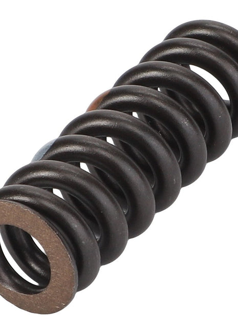 Close-up of the AGCO Compression Spring - F281860030021, a dark metallic spring that is tightly coiled with a perfect cylindrical shape.