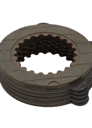 The AGCO | Clutch Disc - 7200460001 is a metal clutch plate stack with grooved circular teeth and interlocking tabs, designed for layered formation in Massey Ferguson models.