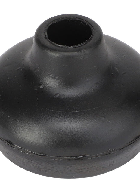 The AGCO | CAP - UT225 by AGCO is a black rubber stopper, dome-shaped with a flat bottom and a hollow center, designed to plug or seal openings.
