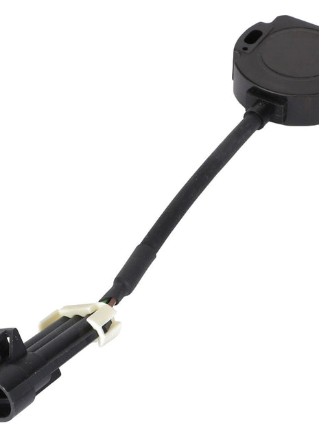 The AGCO | Position Sensor - Acw4977300 by AGCO is a black automotive sensor with an attached cable, featuring a circular base and a rectangular connector at the end of the cable. There is no information available on its specific functionalities or compatibility.