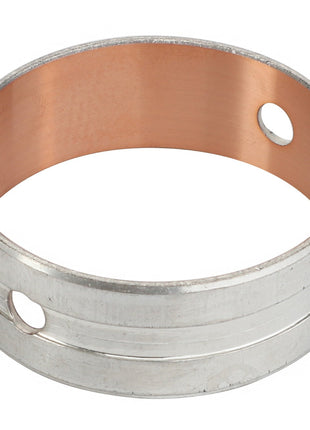 The AGCO BEARING BUSHING - F836200210380 is a cylindrical metal bushing with a copper interior and two precisely aligned holes on opposite sides.