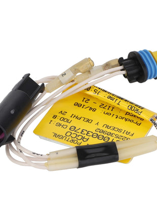 The AGCO | Service Tool - Act0003370 is a compact electronic component equipped with wires and connectors, featuring a yellow label that includes technical information. Currently, there is no detailed product description available.