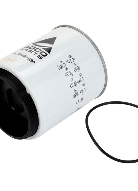 An AGCO Fuel Filter Spin On - Acx2421580, a cylindrical white filter cartridge with a black gasket ring beside it, marked with technical specifications and part numbers, showcases the advanced design of AGCO Fuel Filters. This fuel-filter-water-separator ensures cleaner fuel for superior engine performance.