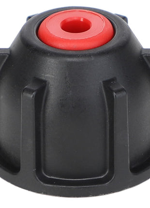 The AGCO | NOZZLE CAP - AG334228 by AGCO is a black plastic knob with a red center, featuring a cylindrical base and vertical ridges around its perimeter. It is ideal for use in Pentair Hypro systems or as part of a Replacement Check Valve setup.