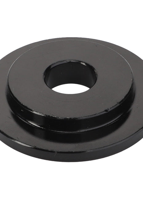 A black metal disc with a central hole and a raised outer edge, viewed from above. Product: AGCO | Washer - Acw0051170. Brand: AGCO.