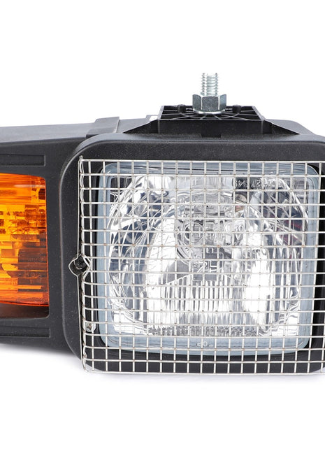 Close-up of the AGCO Combination Light, Headlight & Turn Signal (Left Side - AG519211) with a protective metal mesh cover and an attached amber turn signal indicator on the left side. Mounted on a black housing with a metal screw on top, this durable quality lighting system by AGCO ensures optimal illumination for enhanced visibility.