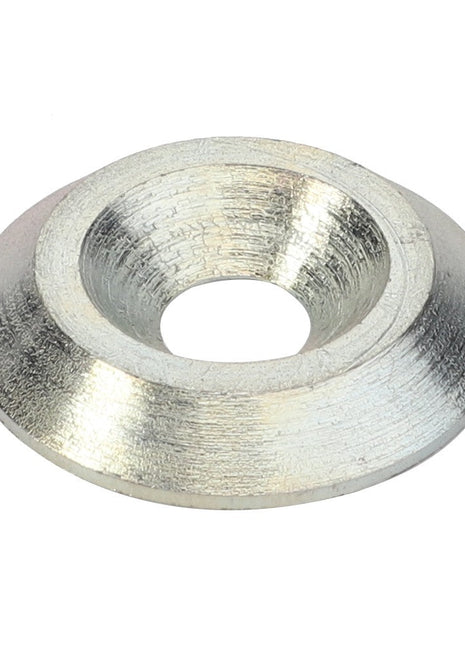 The AGCO | WASHER - D28380586 is a silver metallic countersunk washer with a central hole, specifically designed for use with fasteners to distribute load or prevent damage to the assembled material. Brand: AGCO.