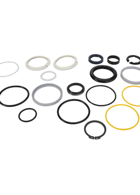 A collection of variously sized and colored rubber and metal rings and washers, precisely arranged on a white background. Introducing the AGCO | GASKET - AL420056 from the renowned brand AGCO.