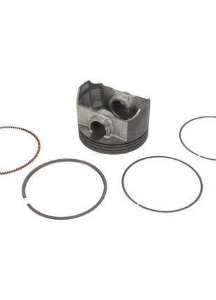 The AGCO Piston - ATV3436-015, along with four high-quality piston rings including an oil control ring, are showcased on a white background for optimal combustion performance.