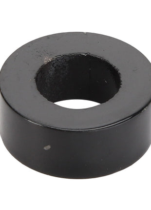 The AGCO | BUSH - AG120283 by AGCO is a black, cylindrical metal washer with a central hole used typically as a spacer or to provide a bearing surface in mechanical applications.