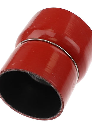 AGCO's Connector - Acw1934020 is a red, cylindrical silicone hose connector equipped with a secure metal clamp around the middle for enhanced stability.