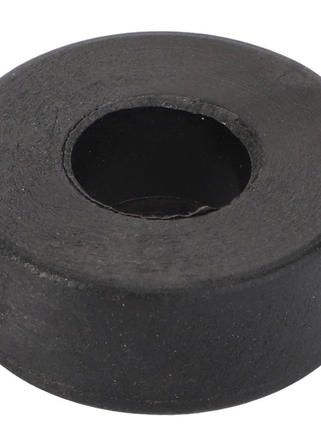 The AGCO Roller - La320927050 by AGCO is a black, round rubber grommet with a central hole, designed for durability and versatility.