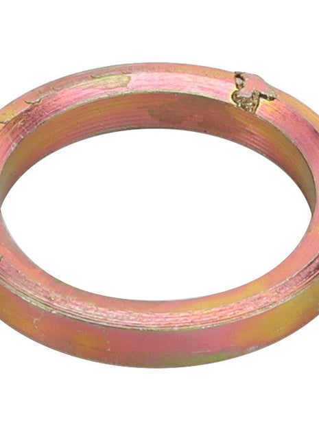 A circular, metallic gasket under the product name AGCO | SPACER - D26735317 has a scratched surface and a small crack at the top edge. No current product description information available.