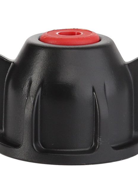 Close-up of the AGCO | CAP - AG427074, a sleek black plastic knob with two side flanges, featuring a vibrant red circular top center.