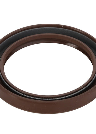 The AGCO Oil Seal - 0.010.2655.1 is a brown circular gasket featuring a metal spring component inside, designed for sealing applications to ensure top performance and reliability.