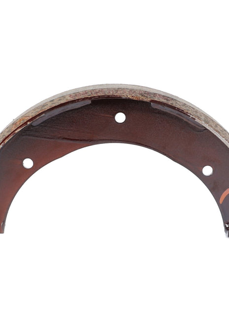 A semicircular, worn AGCO Brake Shoe - F184108150291 from AGCO Parts showcases three circular holes and a mixture of rusty and intact surfaces, reflecting the brake life.