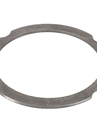 The AGCO Compensating Ring - F007200210320, a round, flat metal ring from AGCO, features four evenly spaced notches along its outer edge, seamlessly blending form and function.