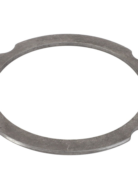 The AGCO Compensating Ring - F007200210320, a round, flat metal ring from AGCO, features four evenly spaced notches along its outer edge, seamlessly blending form and function.