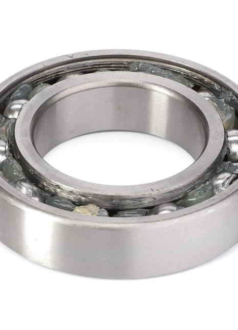 The AGCO Ball Bearing - 0922-13-09-00, featuring visible internal components and grease, is expertly engineered by AGCO to handle both radial and axial loads while efficiently reducing rotational friction.