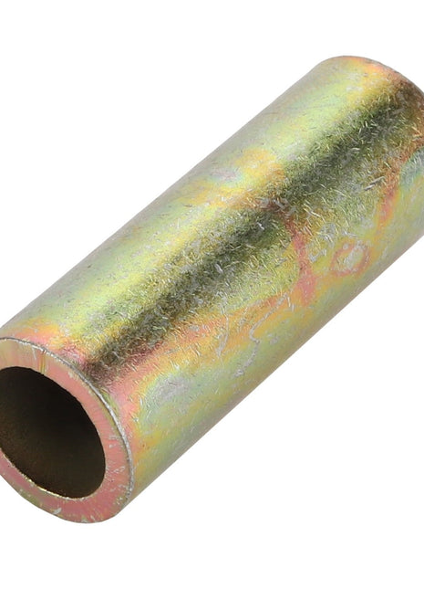 The AGCO Spacer - Acp0028320, a cylindrical metal tube with a reflective, multicolored surface, gleams under the light. One end reveals the open hollow interior.