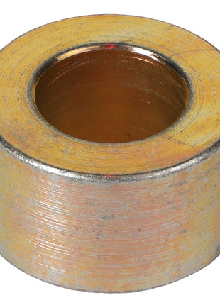 A metal cylindrical spacer with a large central hole and a rough-textured surface. No current product description available. Product Name: AGCO | Spacer - 112253W1 by AGCO.