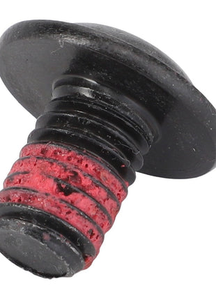 A close-up of an AGCO Torx Head Screw - Acx2570390 with a flat head and red adhesive meticulously applied to the threaded part.